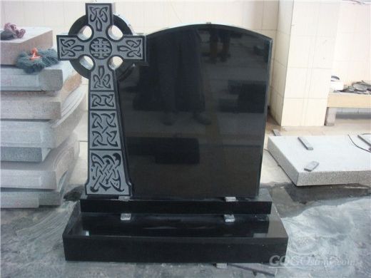 Black granite headstone with cross