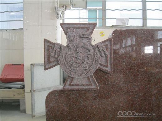 Traditional granite tombstone with cross