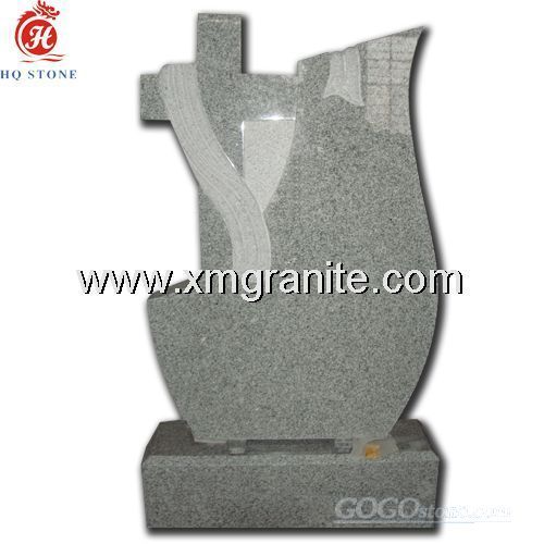 Polished grey granite monument with cross