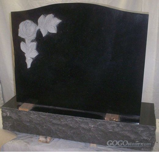 black headstone with rose carving