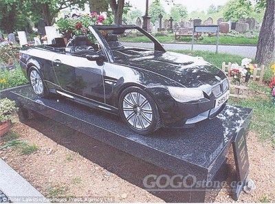 Granite monument with car for grave