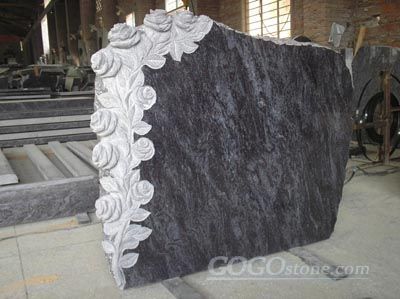Granite monument with  flower carving