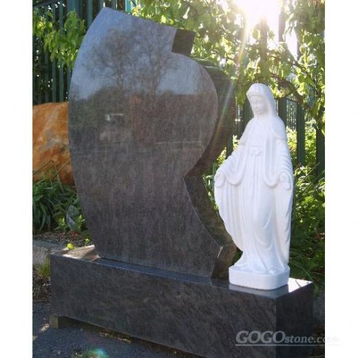 Religious granite headstone with sculpture