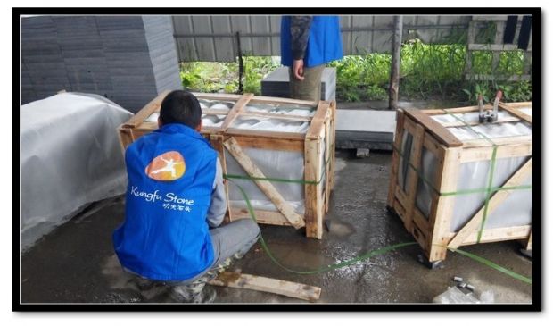 Workers Packing Granite