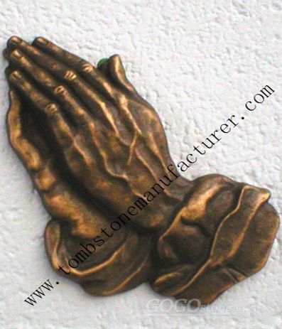 bronze praying hands
